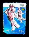 A stamp printed in Australia shows an image of women hockey in Olympics game on value at 45 cent.